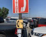 emergency phone by guardian on a outdoor pole in a parking lot